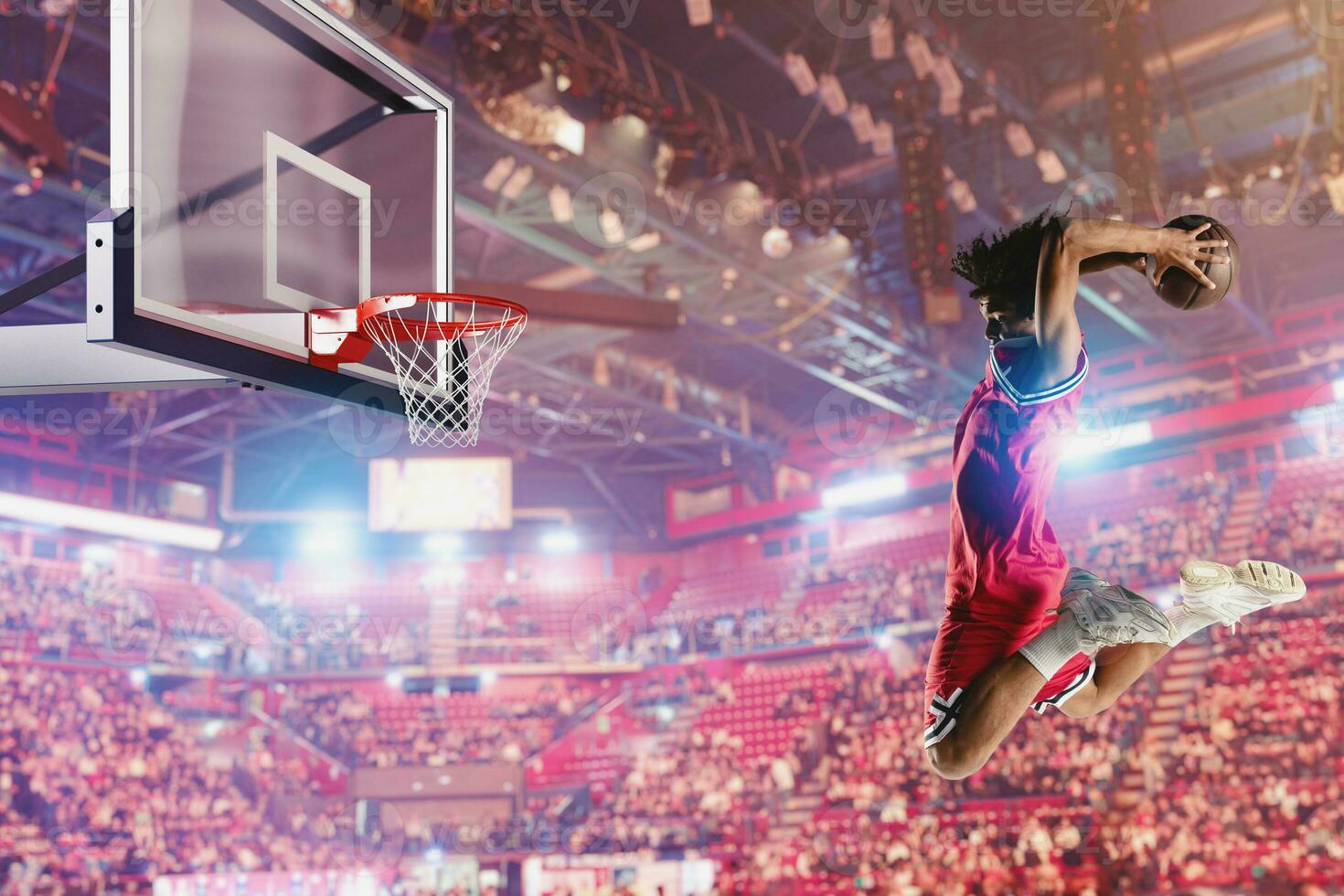 Basketball player jumping to make a basket during a match photo