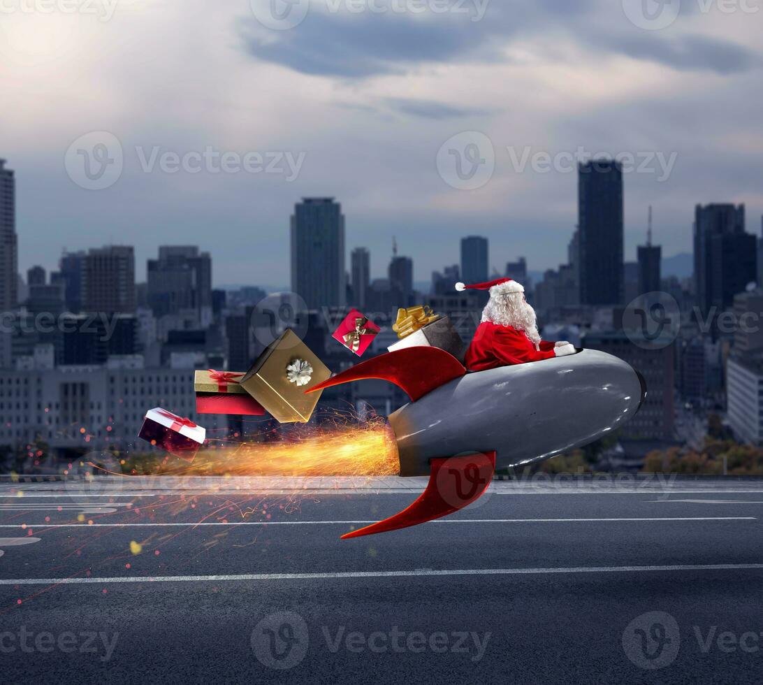 Santa claus delivers gifts with a fast space rocket photo