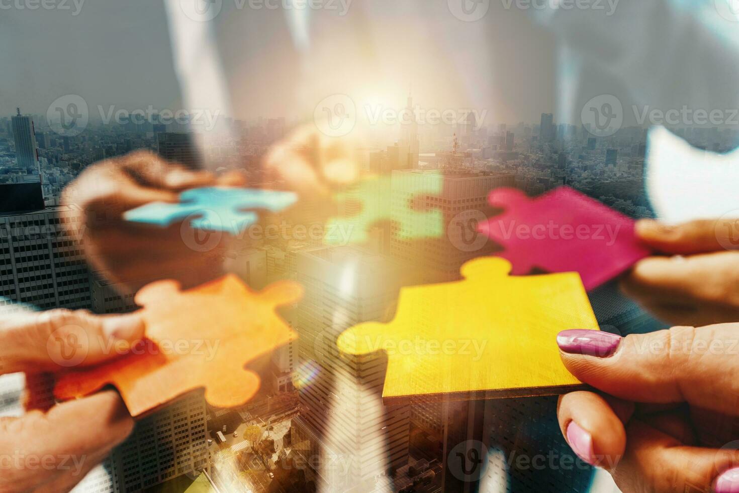 Teamwork of partners connect puzzle pieces as integration and startup photo