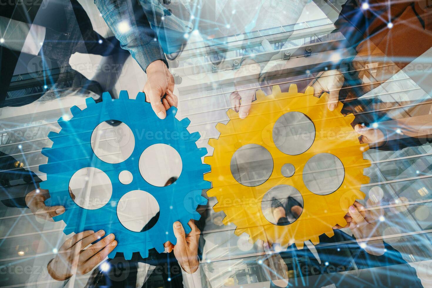 Business team connect pieces of gears like a teamwork and partners photo