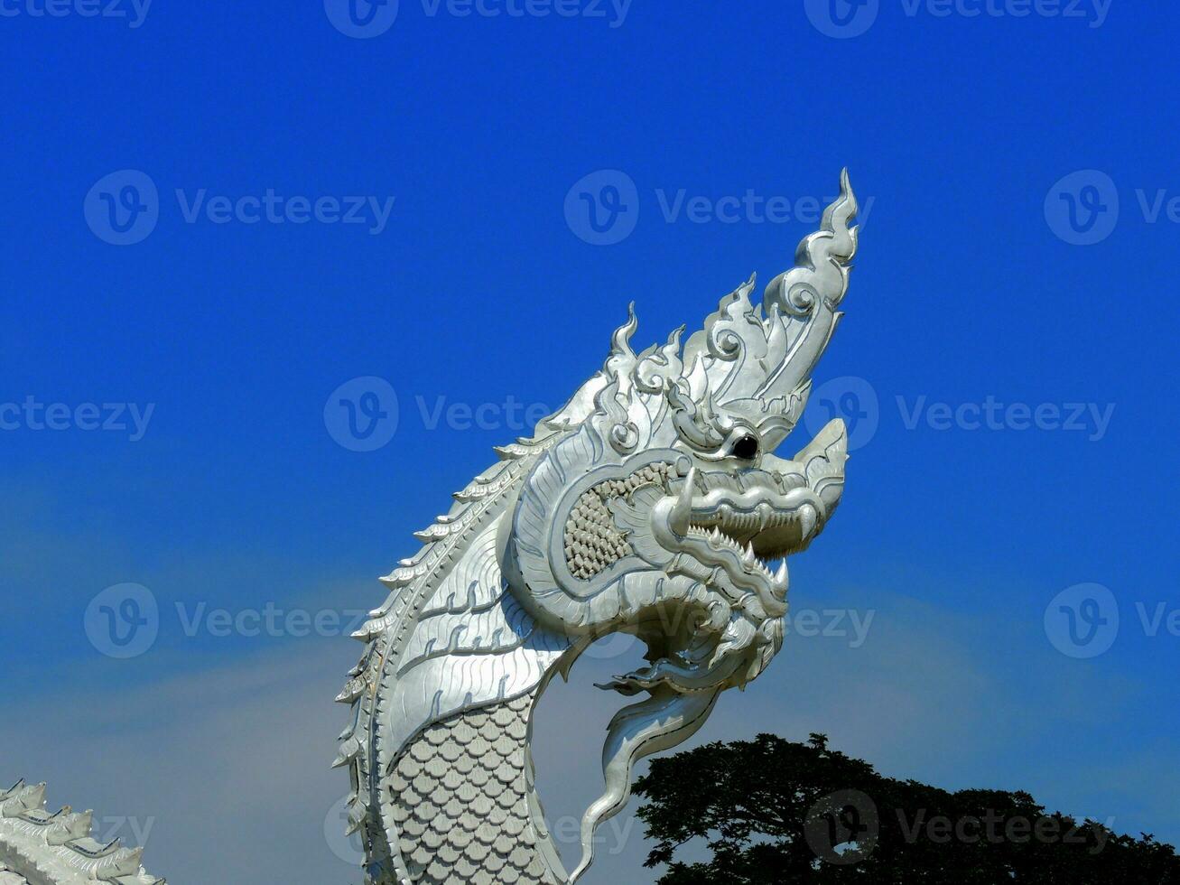 A large white Naga statue or King of Nagas at Kaeng Kabao, Mukdahan photo
