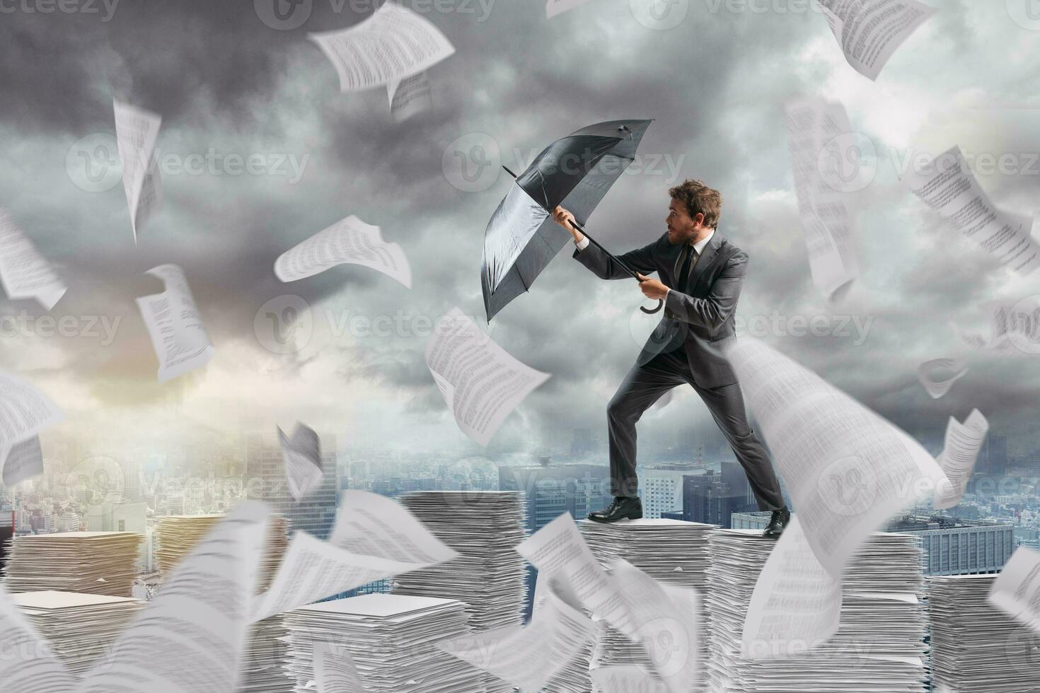 Businessman cover himself from a bureaucracy storm with an umbrella photo