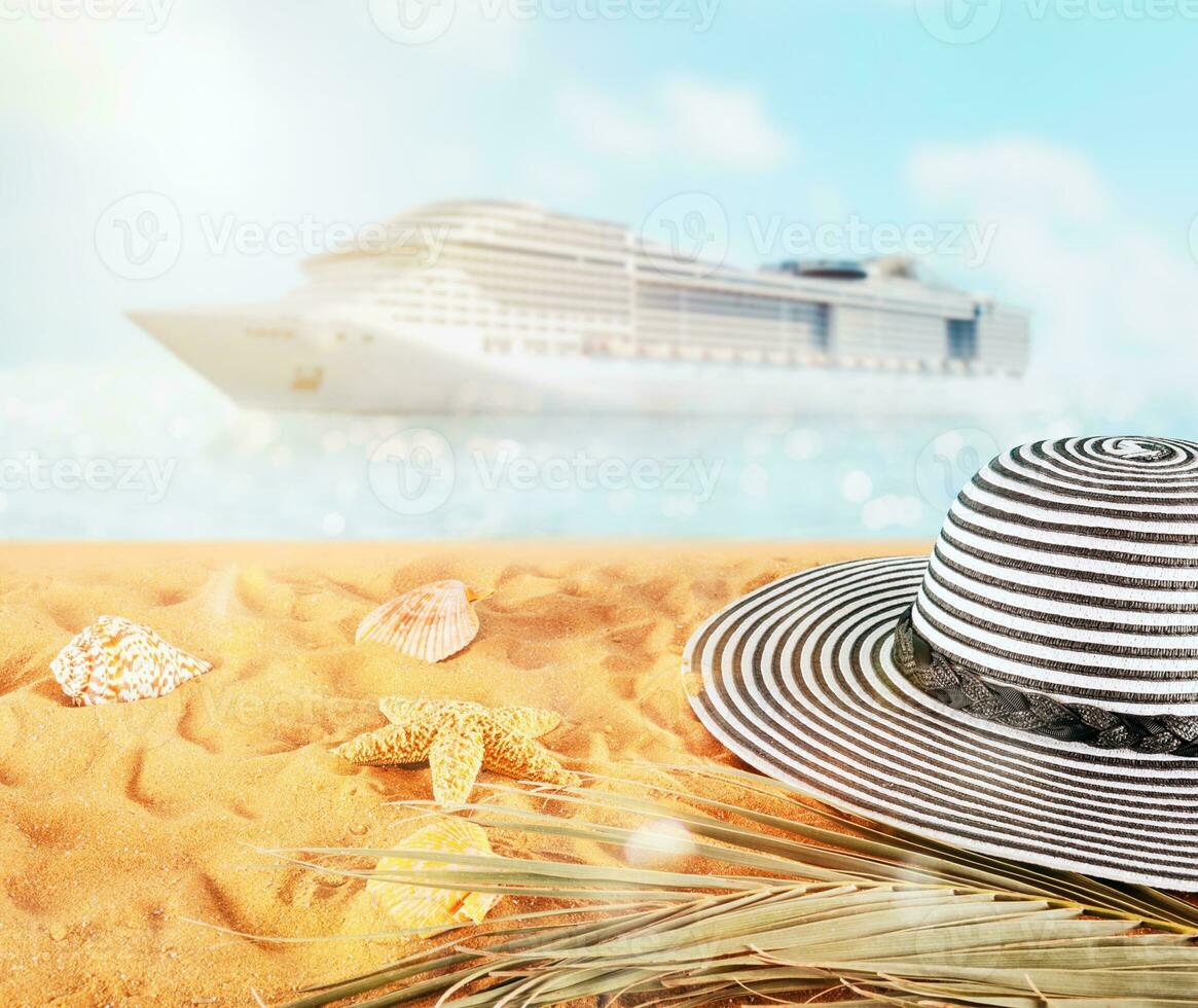 Female hat on a golden sand at the tropical beach photo