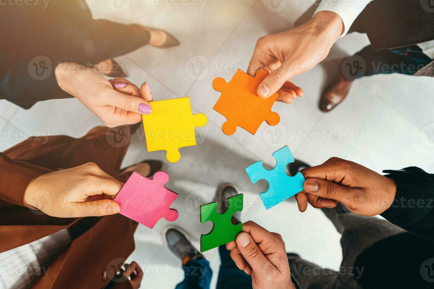 Teamwork of partners connect puzzle pieces as integration and startup photo