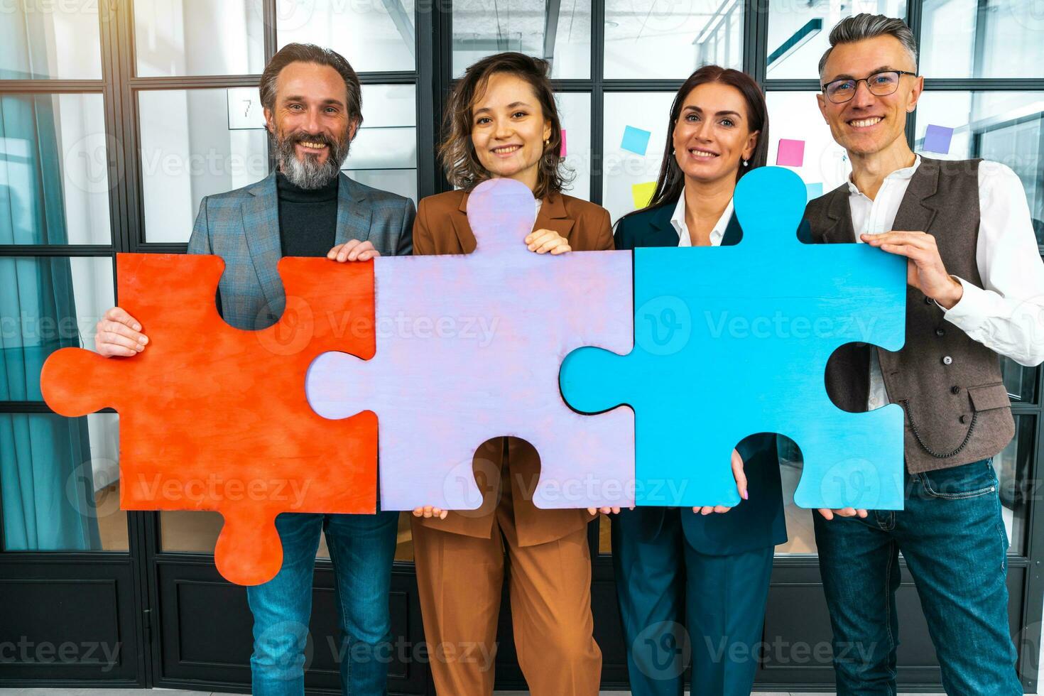 Teamwork of partners connect puzzle pieces as integration and startup photo