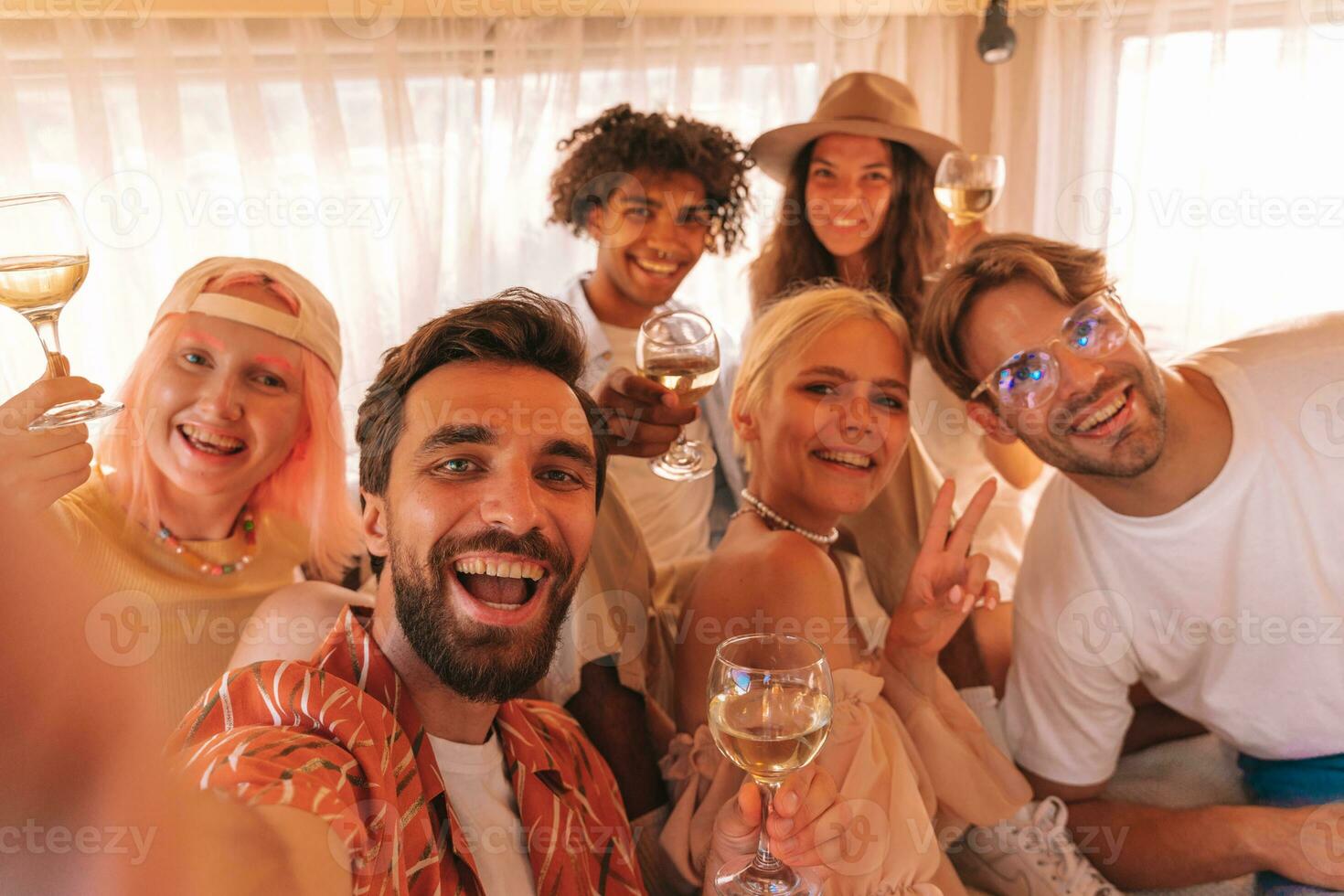 Group of happy friend have a trip with a camper photo