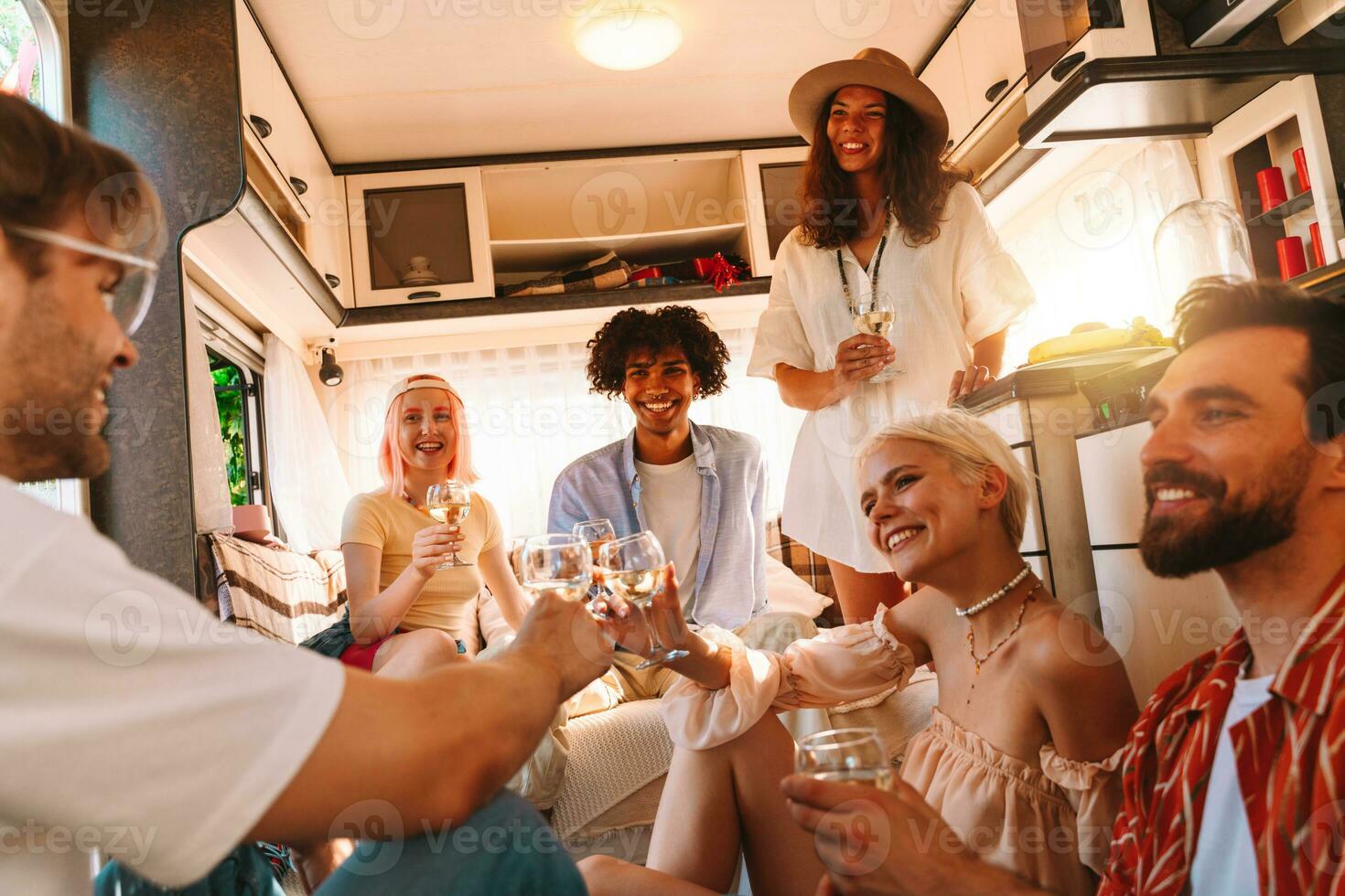 Group of happy friend have a trip with a camper photo