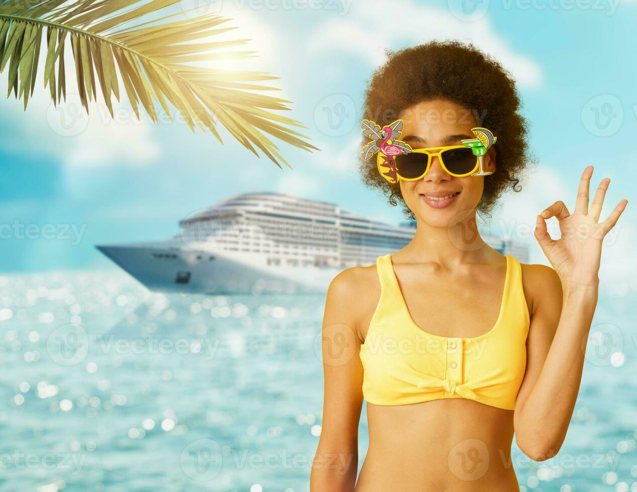 Happy woman in vacation with cruise ship does ok with the hand photo