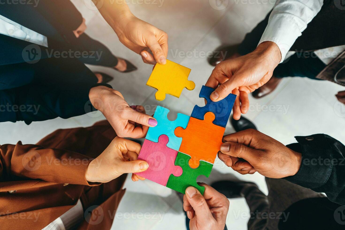 Teamwork of partners connect puzzle pieces as integration and startup photo