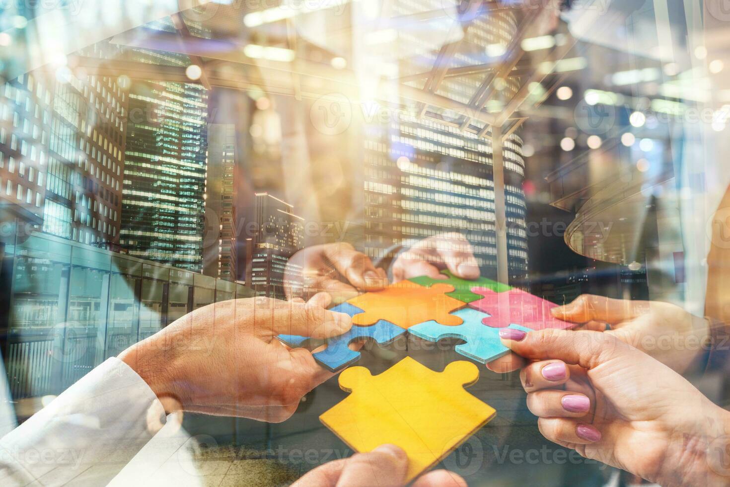 Teamwork of partners connect puzzle pieces as integration and startup photo