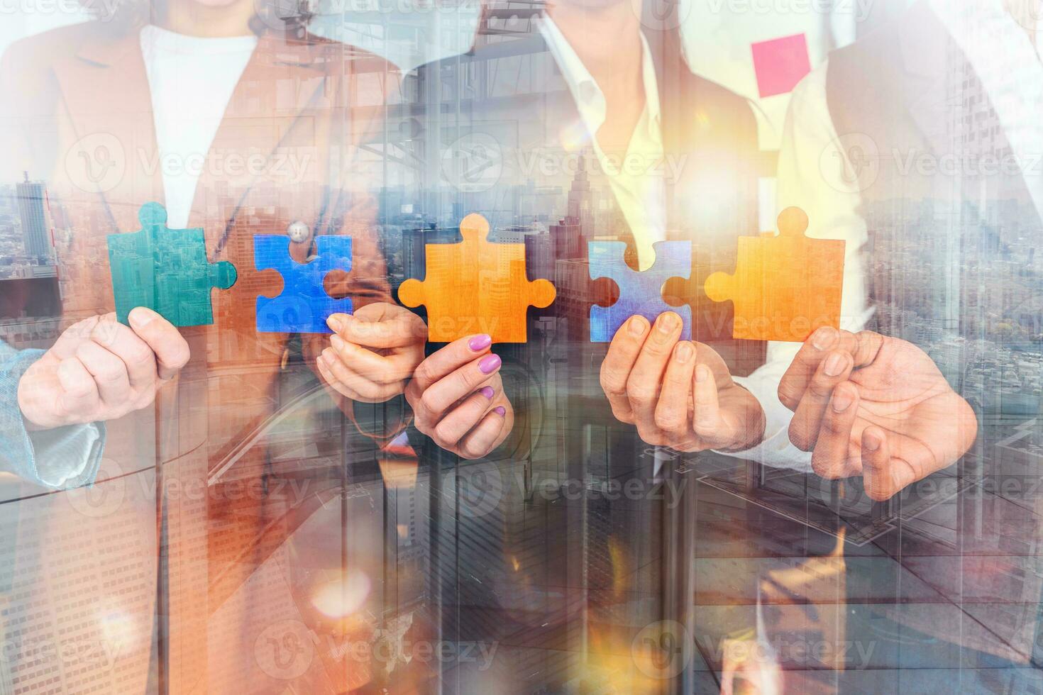 Teamwork of partners connect puzzle pieces as integration and startup photo