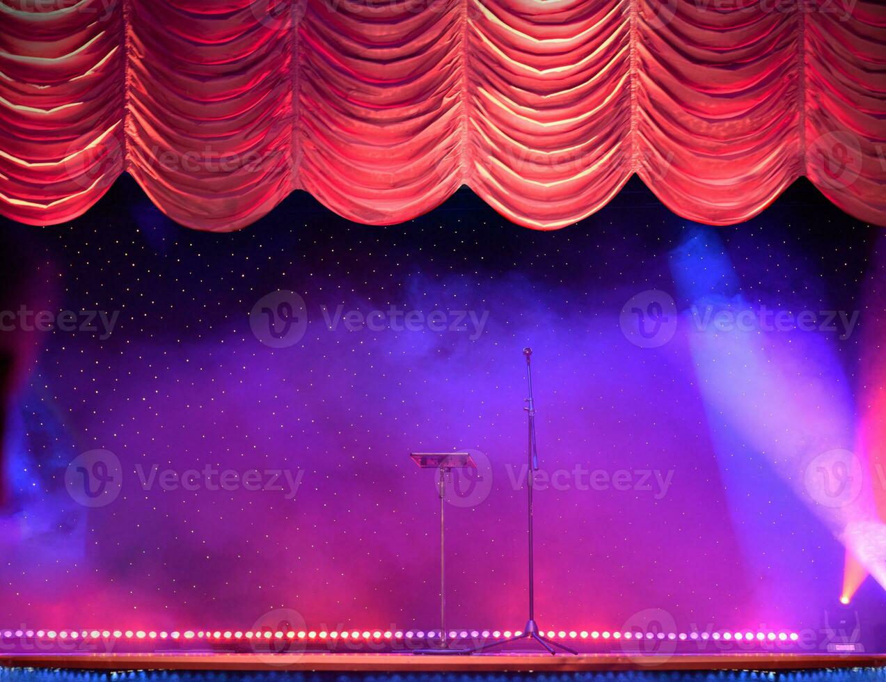 Elegant theater stage with the red curtains opening photo