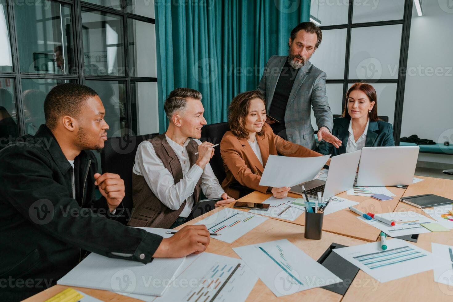 Business people in office connected on internet network analyzing statistics photo