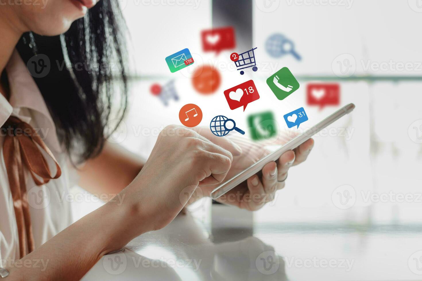 Woman's hand using smartphone with notification icons for social media and technology concept photo