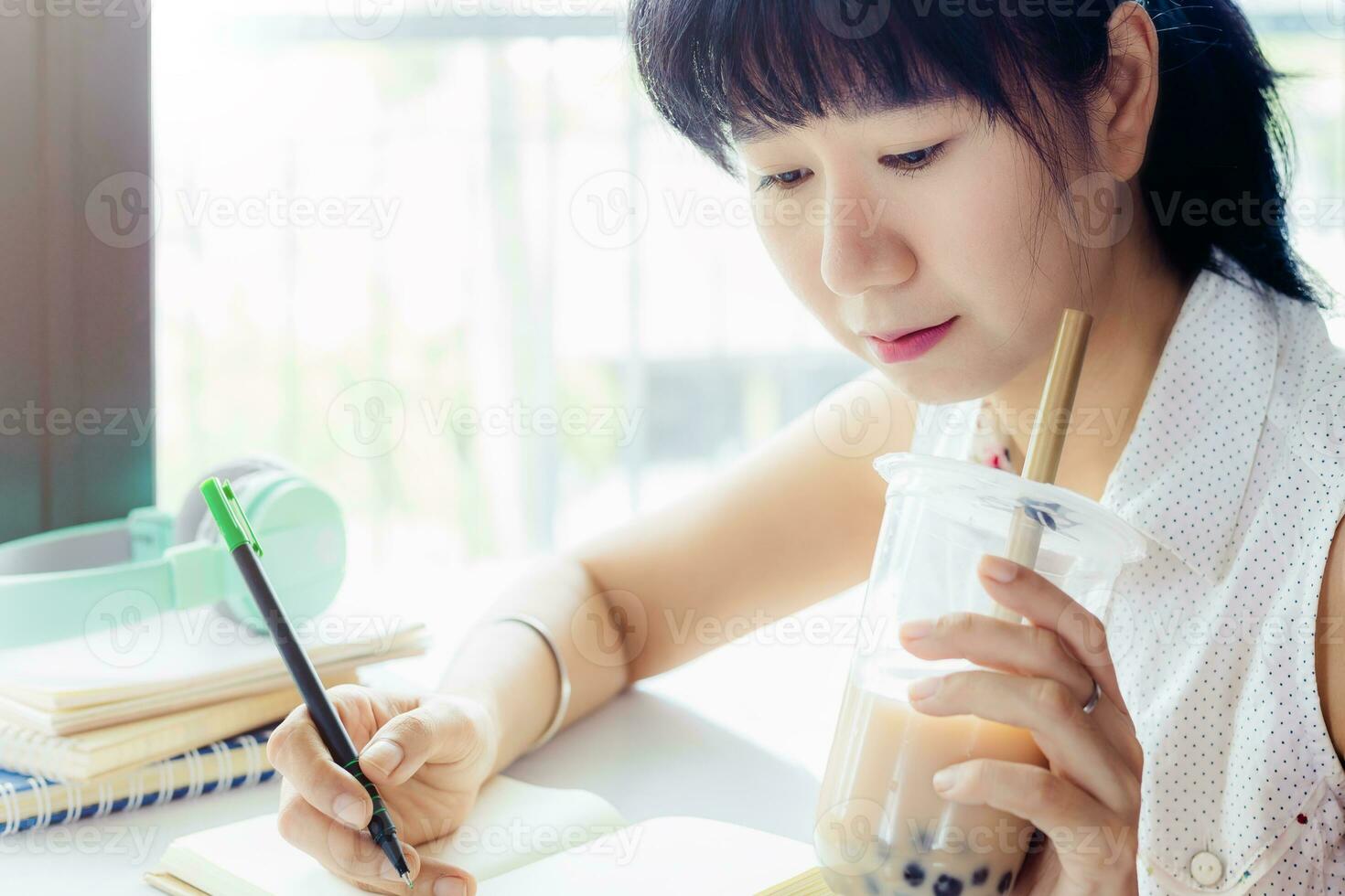 Asian woman staying and working at home photo