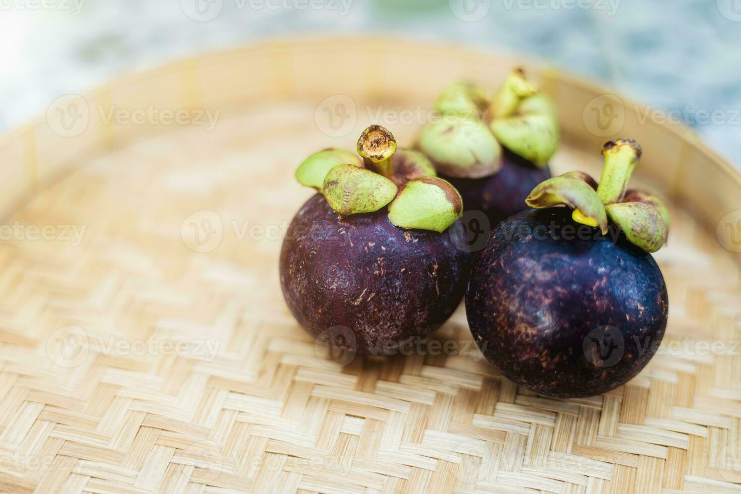 Mangosteen fruit on the wooden tray photo