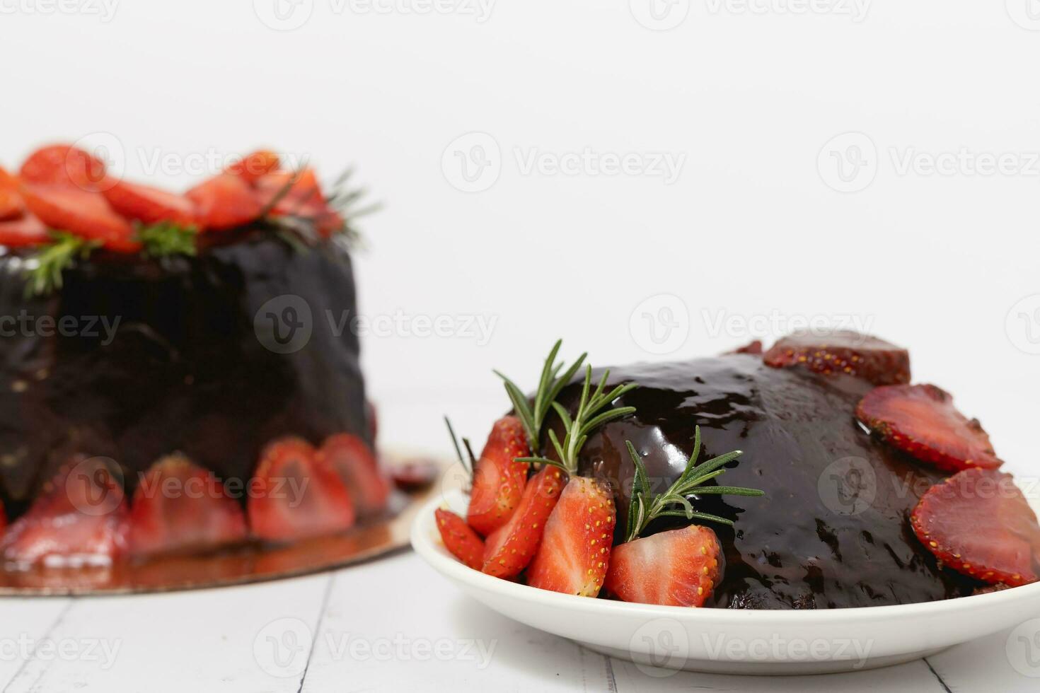 A piece of delicious chocolate cake with strawberries photo