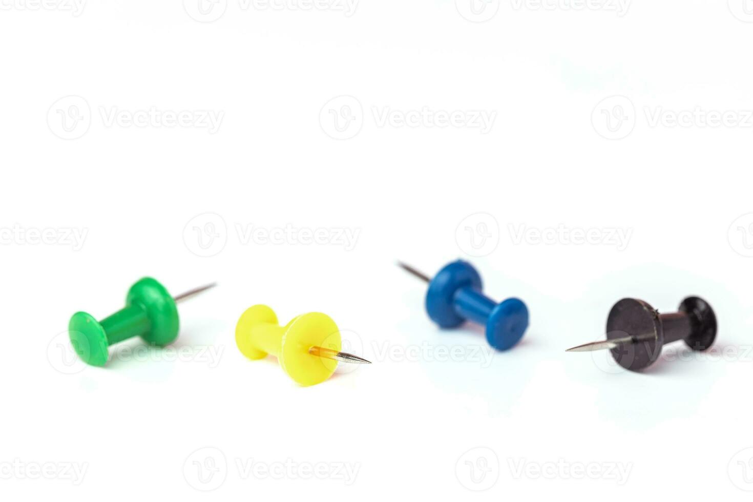 Push pins on white background photo