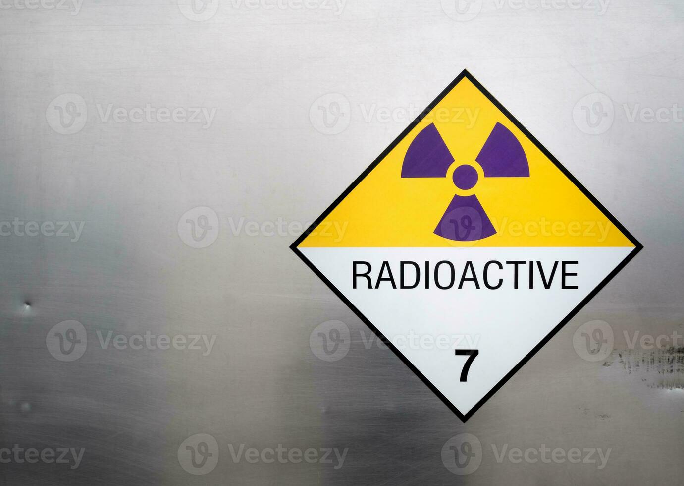 Radiation warning sign on the Dangerous goods transport label Class 7 at the container of transport truck photo