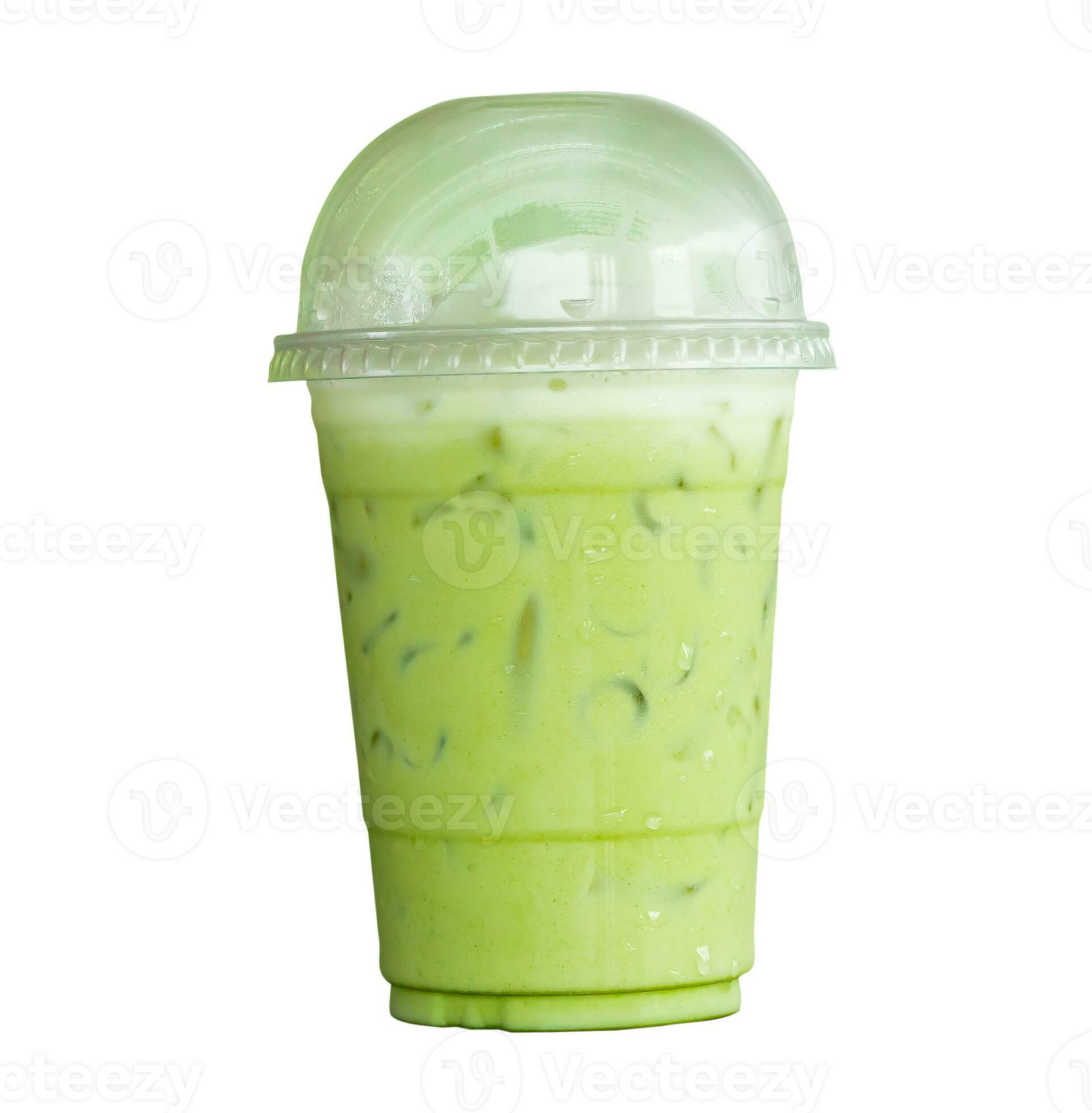Iced matcha green tea with condensed milk in transparent plastic glass