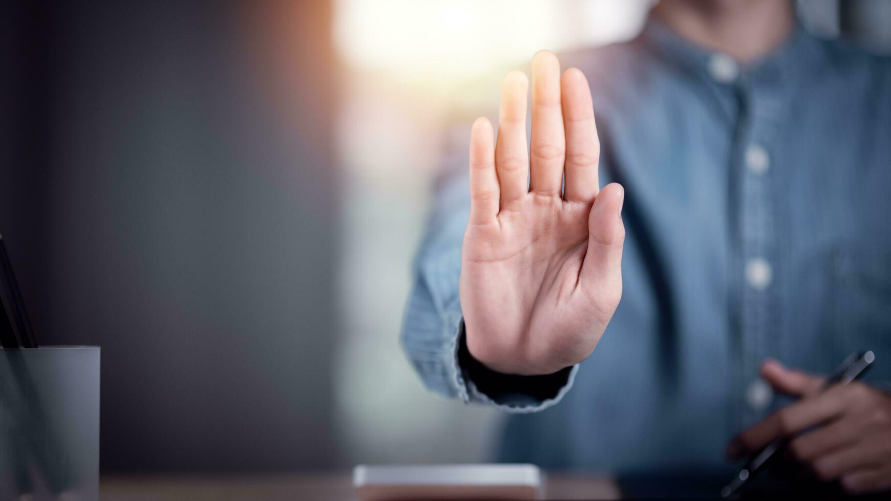 human hand stop sign, warning concept, refusal, caution, symbolic communication, preventing subsequent problems ,Help Prevent Piracy , Stop Violence ,Warning gestures to stop and check safety photo