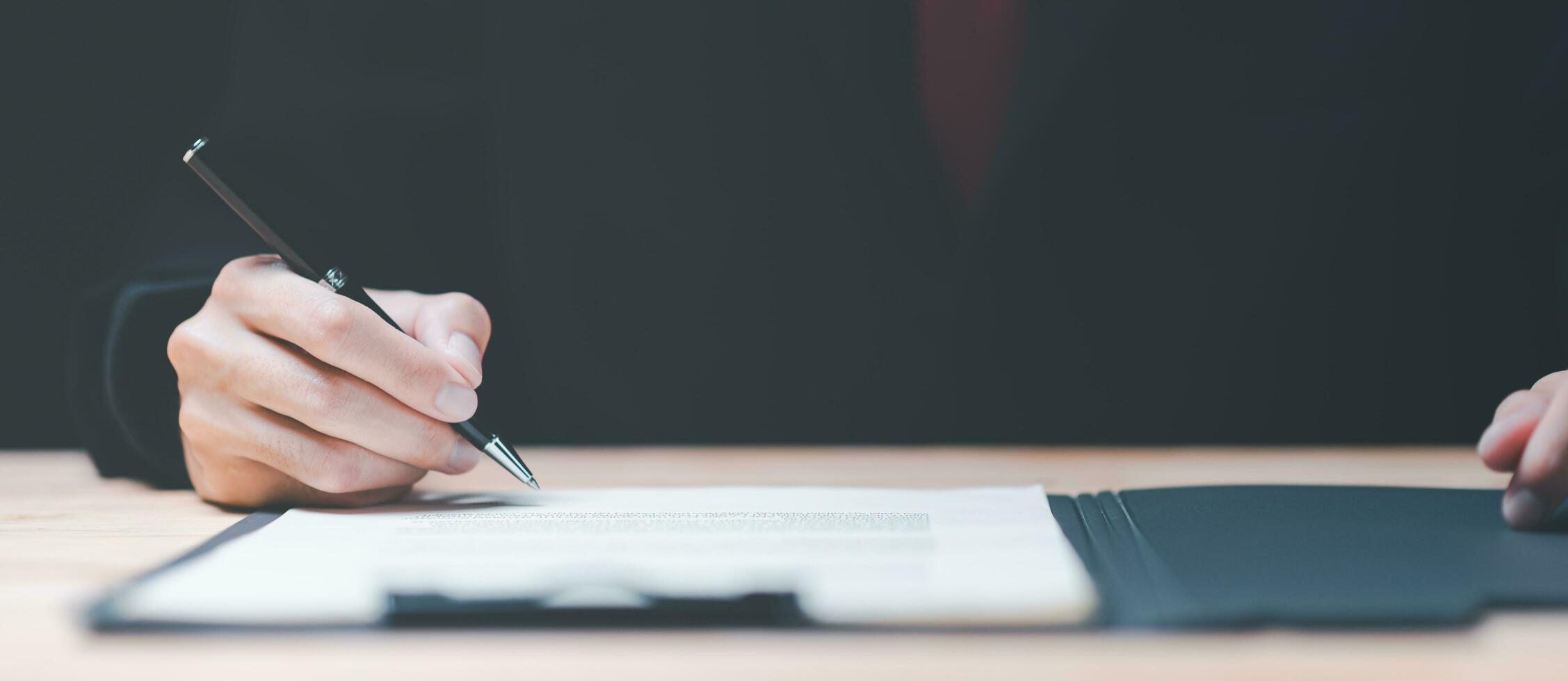 Businessman validates and manages business documents and agreements ,legal contract, signing a business contract approval ,joint venture agreement ,contract documents confirmation photo