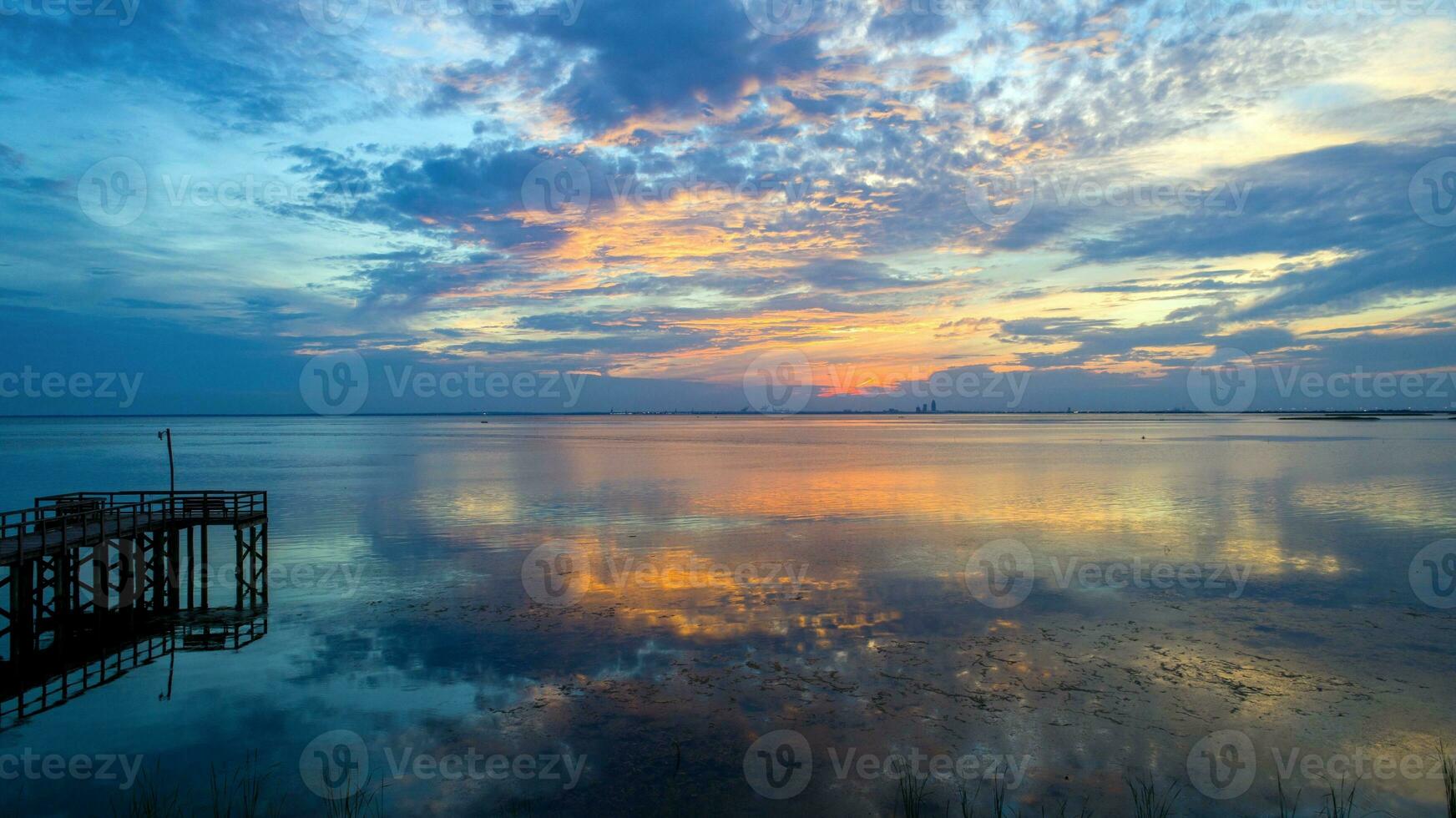 Beautiful sunset over Mobile Bay on the Alabama Gulf Coast photo