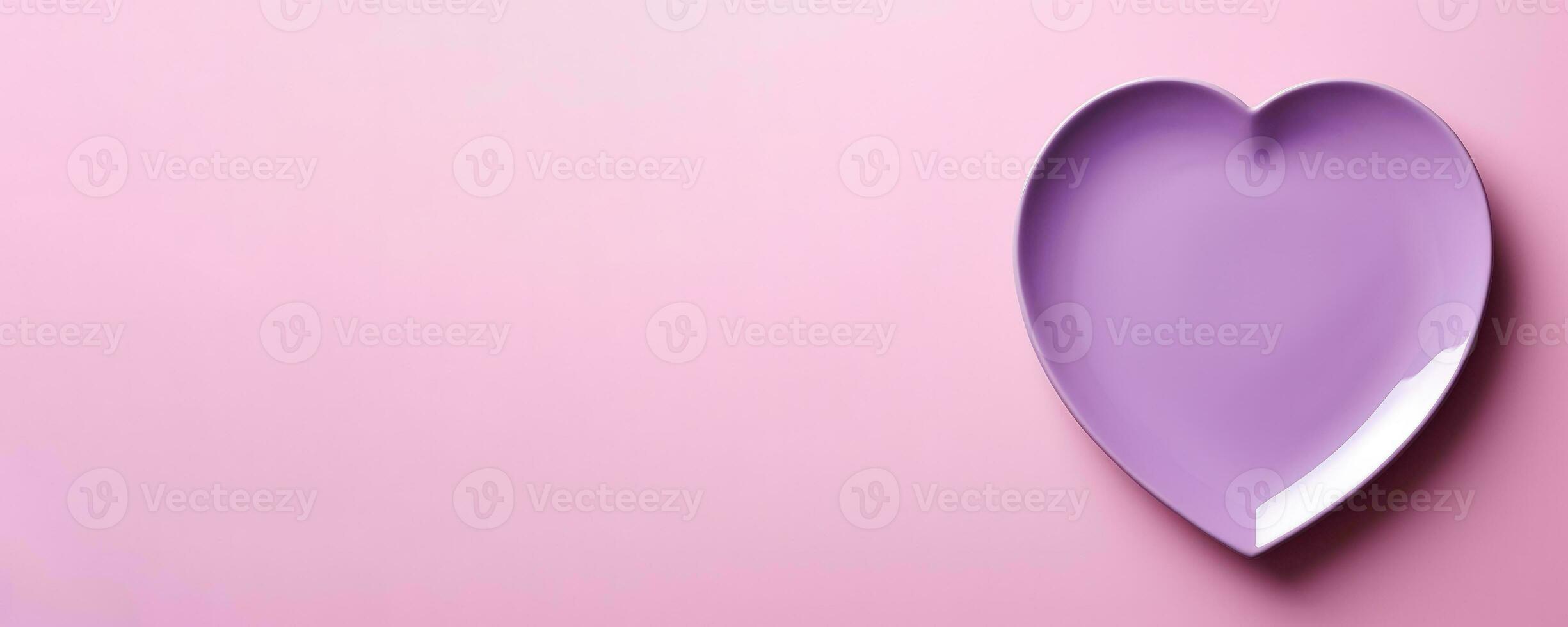 Vivid heart plate isolated on background with a copy space, top view photo