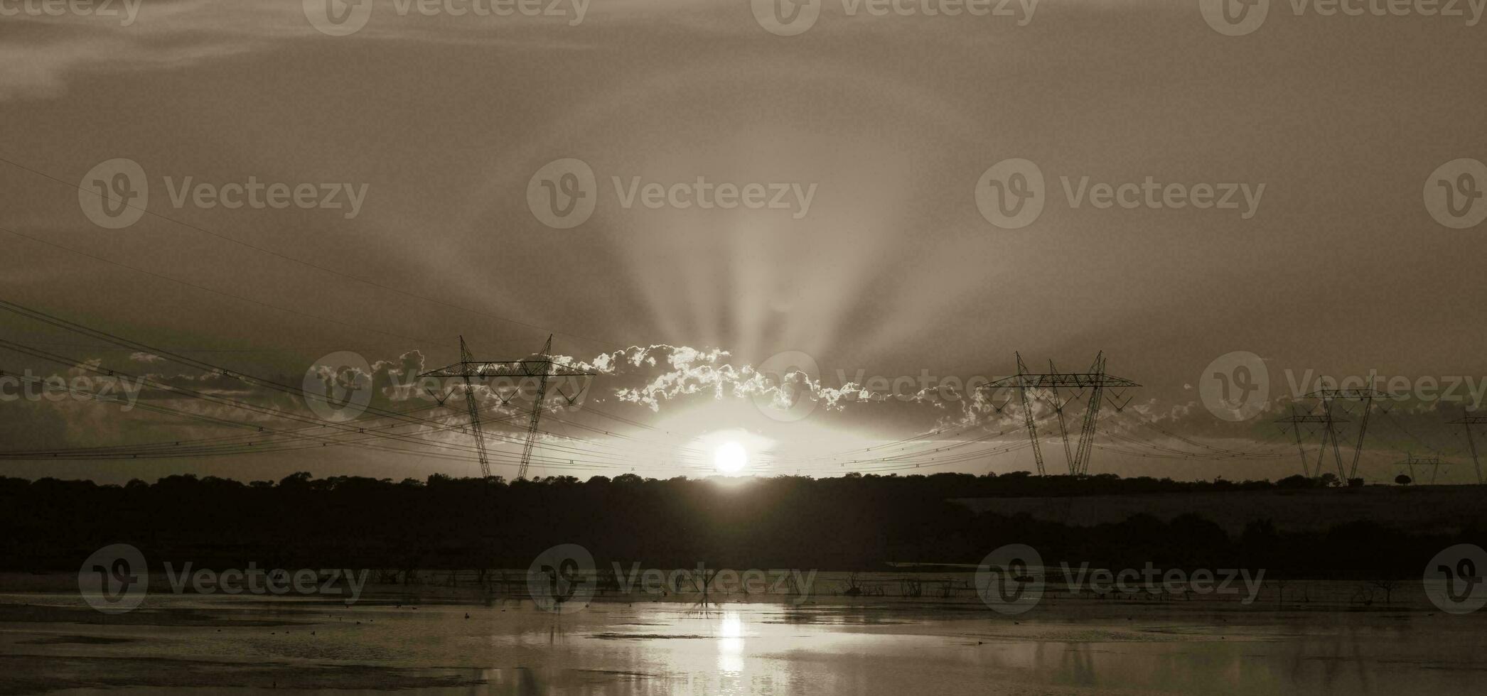 High voltage power line at sunset, Pampas, Argentina photo