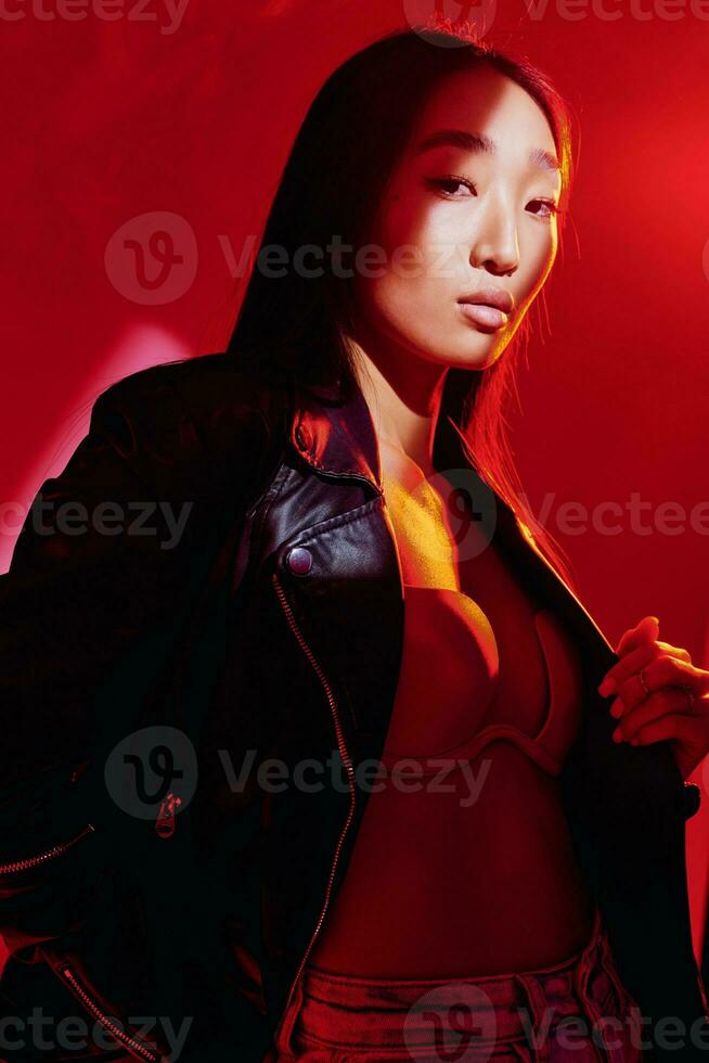 Woman neon concept future trendy dark colourful light art fashion red portrait model hair photo