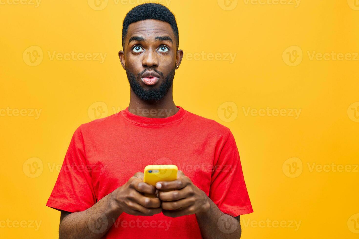 background man happy yellow young phone african technology business mobile red black photo