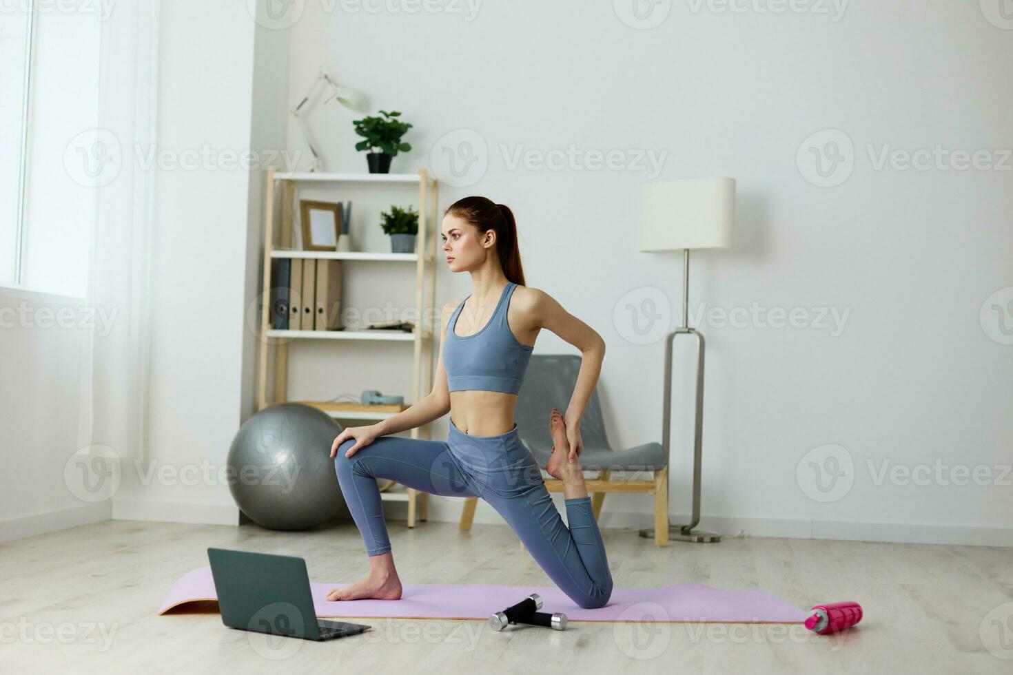 woman home training lotus yoga lifestyle video laptop health gym mat photo