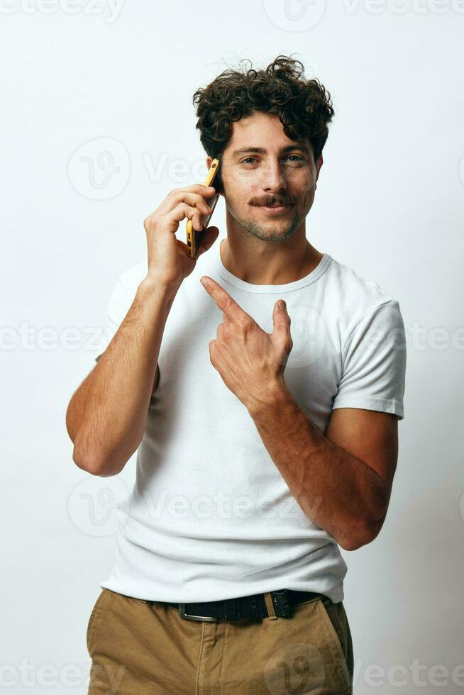Man christmas business t-shirt lifestyle white online portrait holding technology phone message background hipster photo