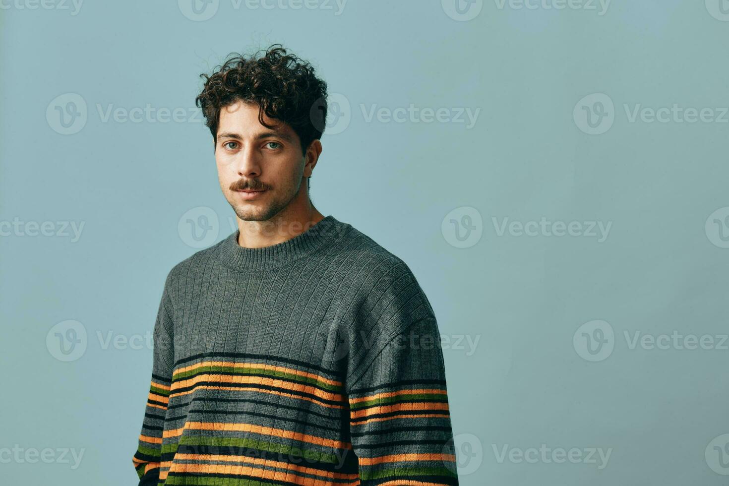 Man attractive handsome gray portrait hipster face trendy sweater copyspace smile fashion photo
