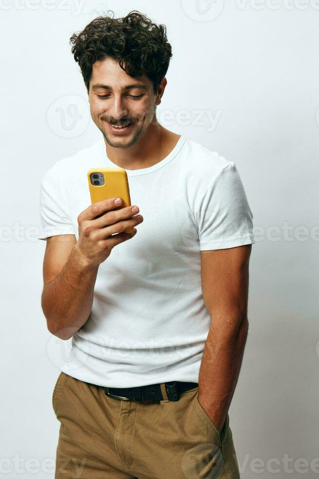 Man online t-shirt chatting guy white hipster technology portrait message phone selfie shopping lifestyle photo