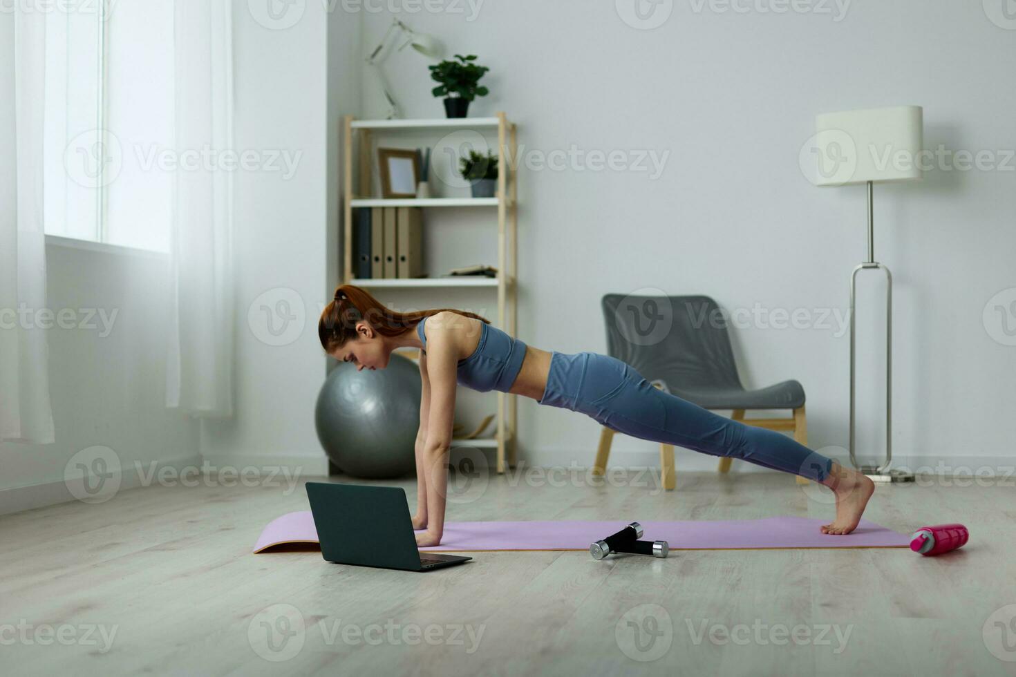 woman yoga gray video home lifestyle lotus health mat laptop training photo