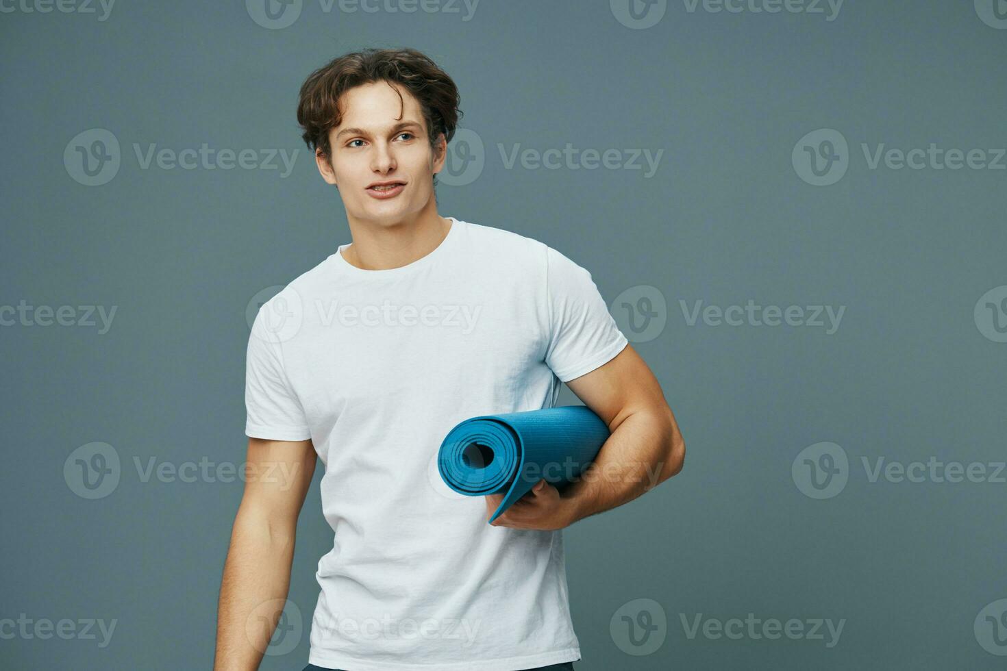 fit man young sport studio body background yoga fitness mat pose exercise photo