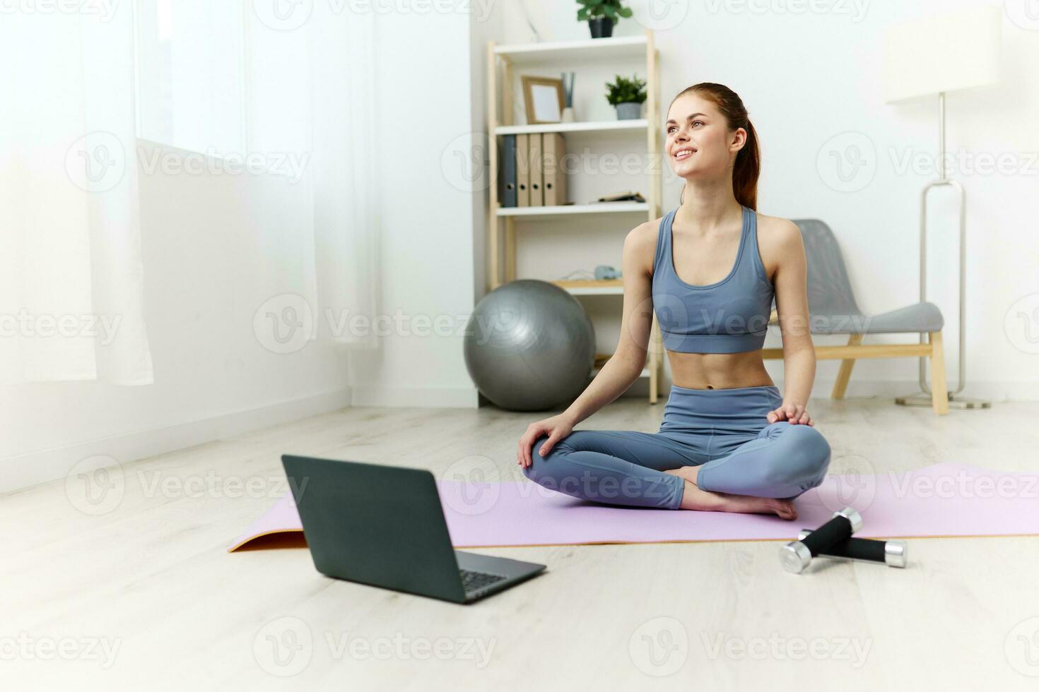 lifestyle woman lotus health video mat home laptop care training yoga photo