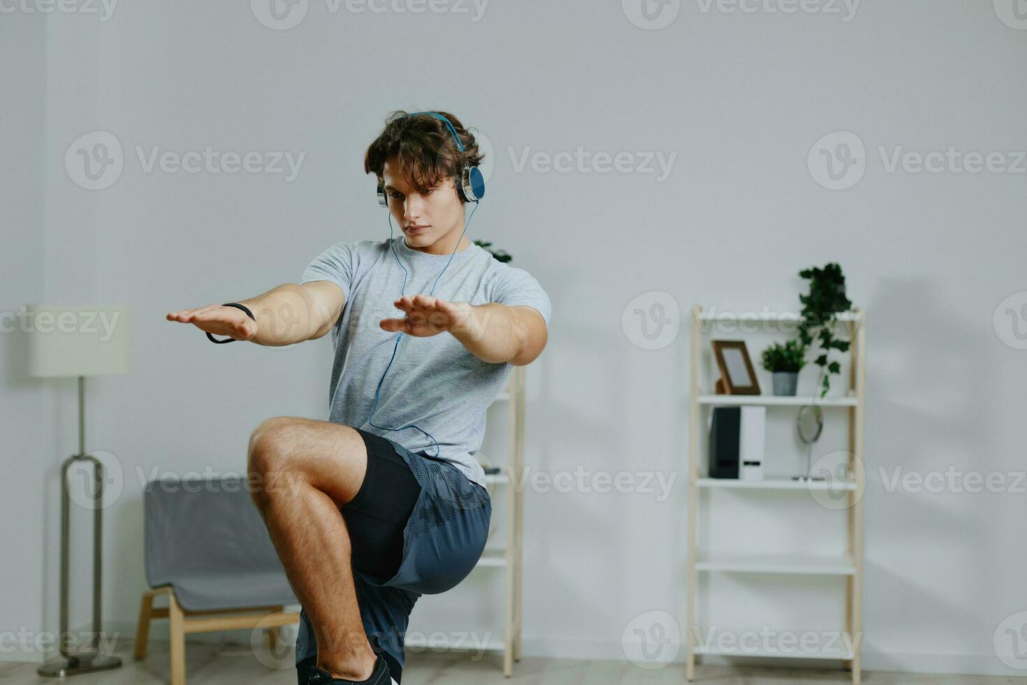 indoor man home lifestyle workout healthy activity gray sport headphone training photo