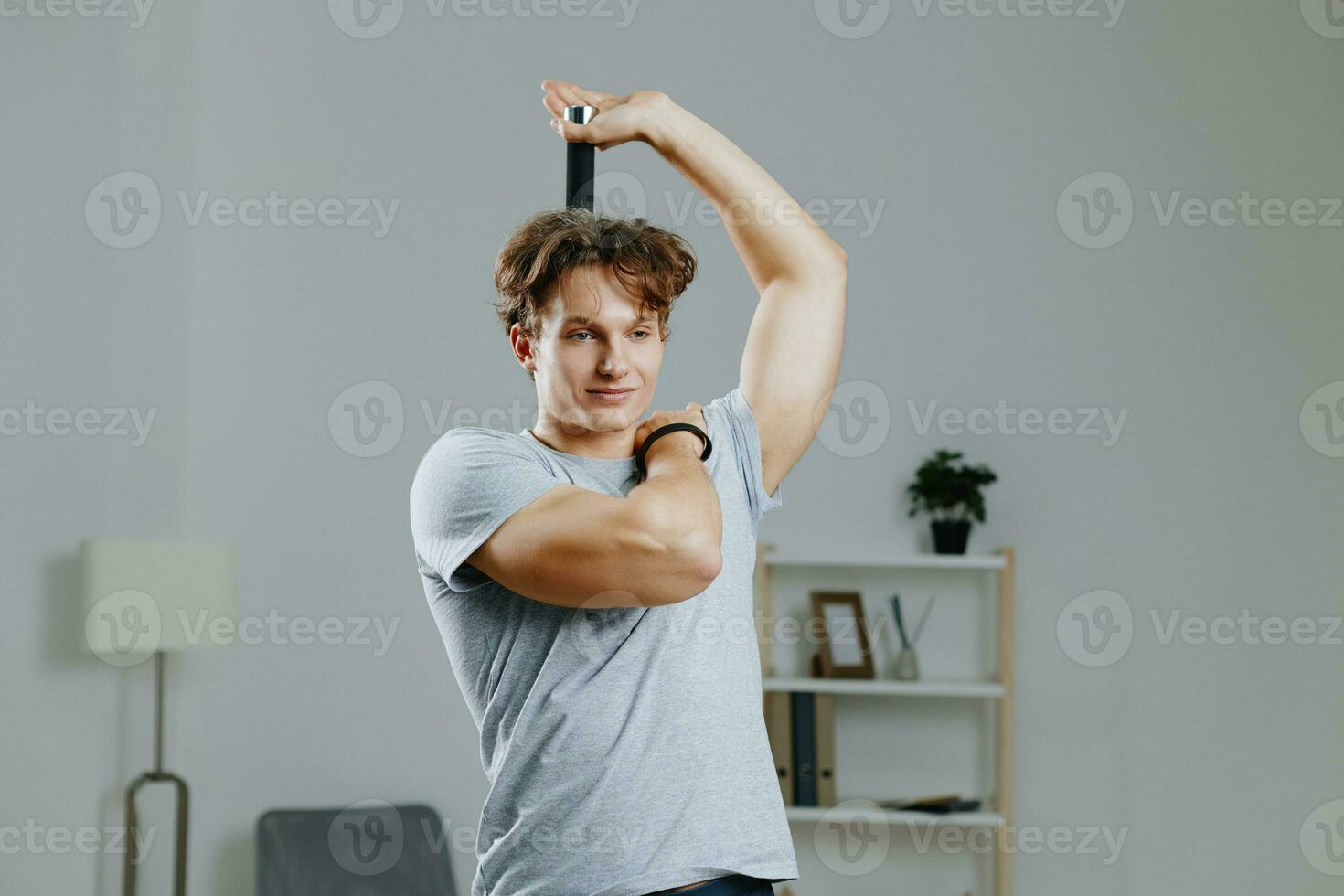 gray man training indoor sport activity strength home dumbbells health lifestyle photo