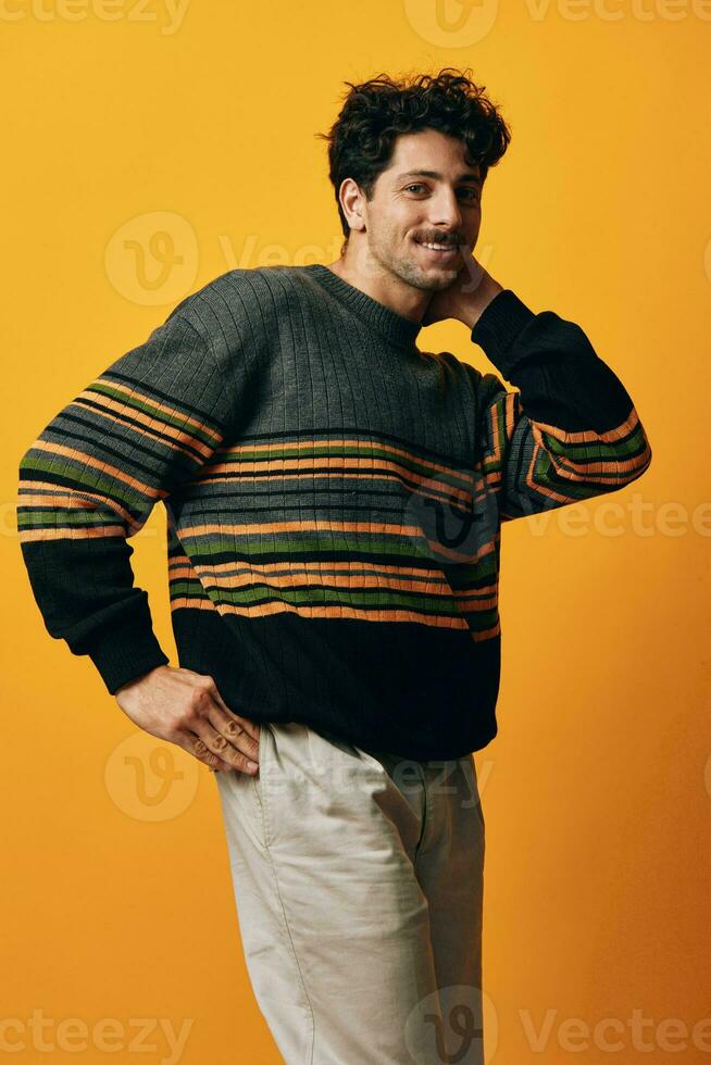Man smile sweater orange face lifestyle happy trendy fashion student expression portrait background thoughtful photo