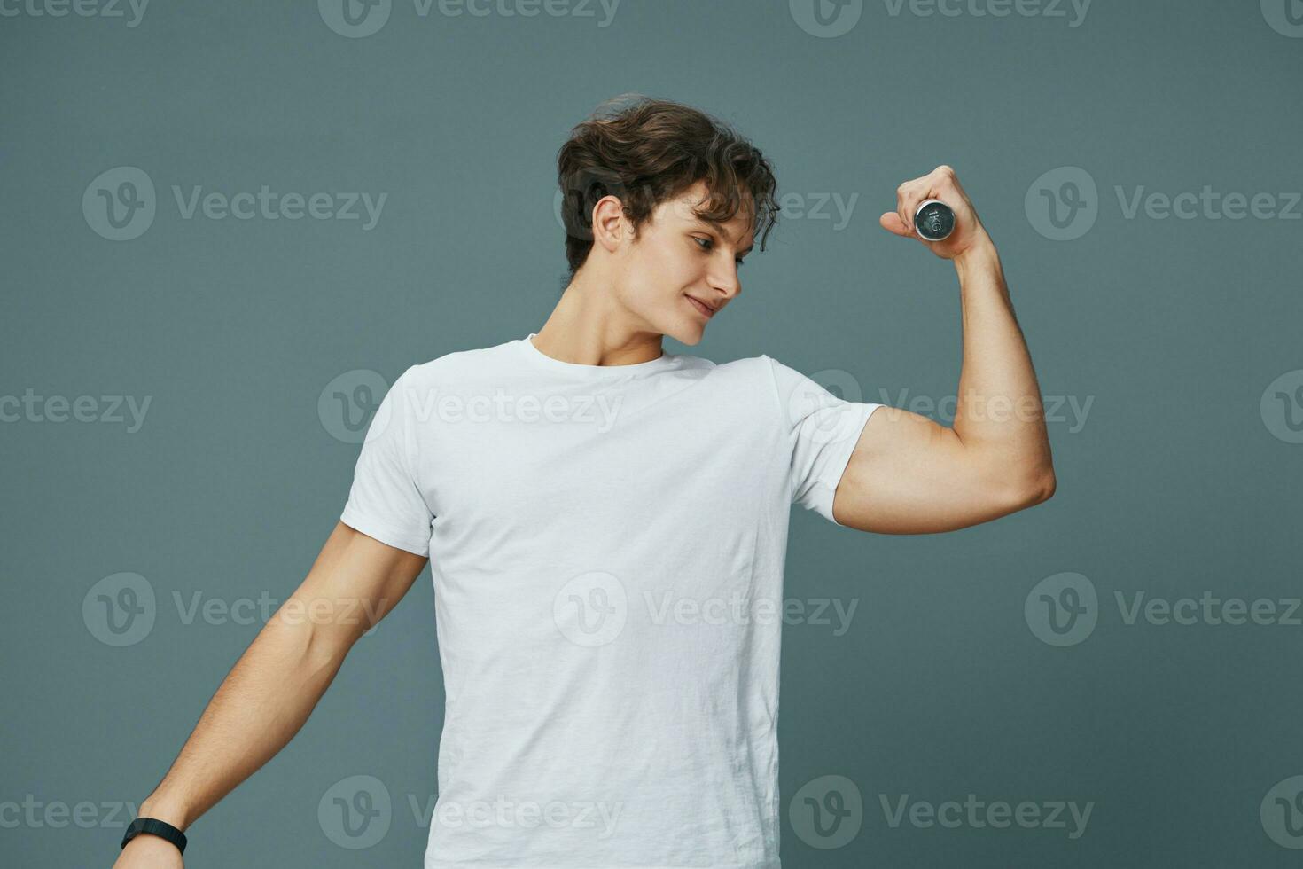 young man holding sport dumbbell strong lifestyle fitness fit exercise training photo