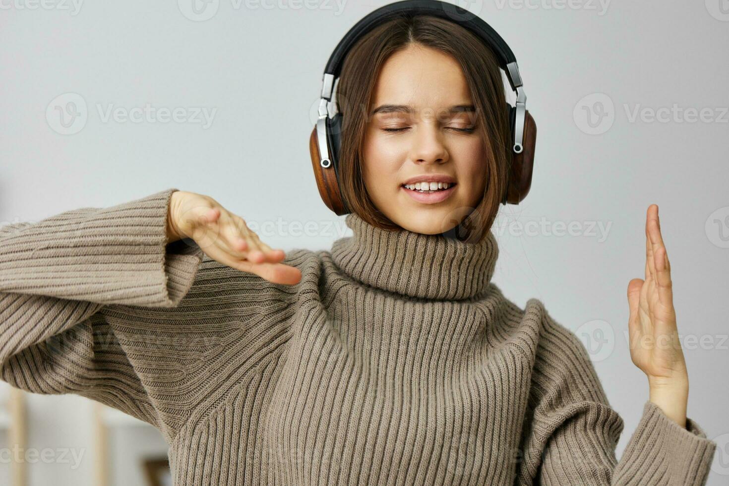 woman indoor young earphones music home student happy cheerful headphones caucasian photo