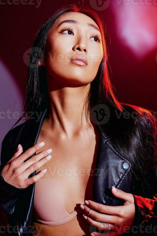 Woman colourful fashion portrait abstract trendy style art neon concept light red studio photo