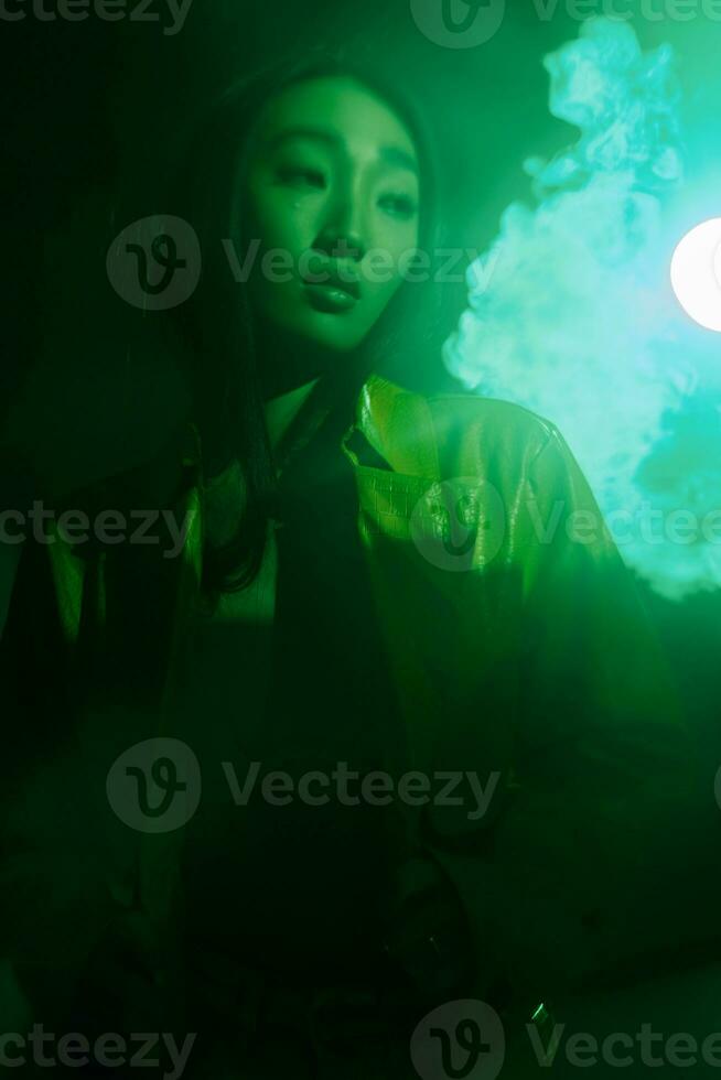 Beauty woman colourful neon glamour modern green art portrait smoke future light concept trendy photo