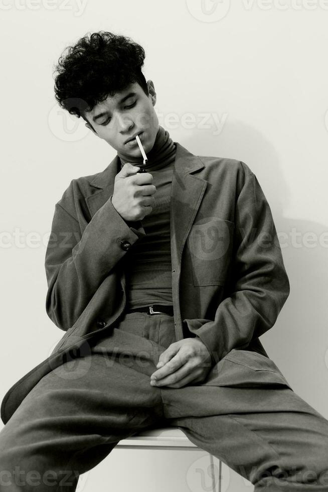 Man smoking and sitting portrait cigarette white black fashion photo