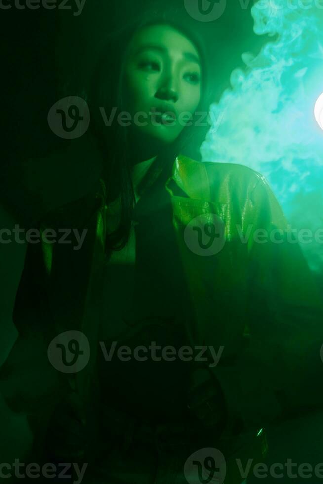 Woman trendy neon green abstract art smoke portrait colourful light concept futuristic photo