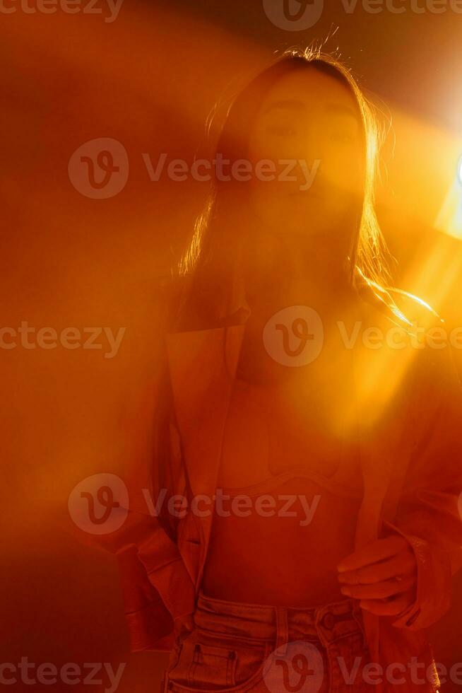 Woman adult trendy portrait art stylish neon beauty light fashion colourful concept orange person photo
