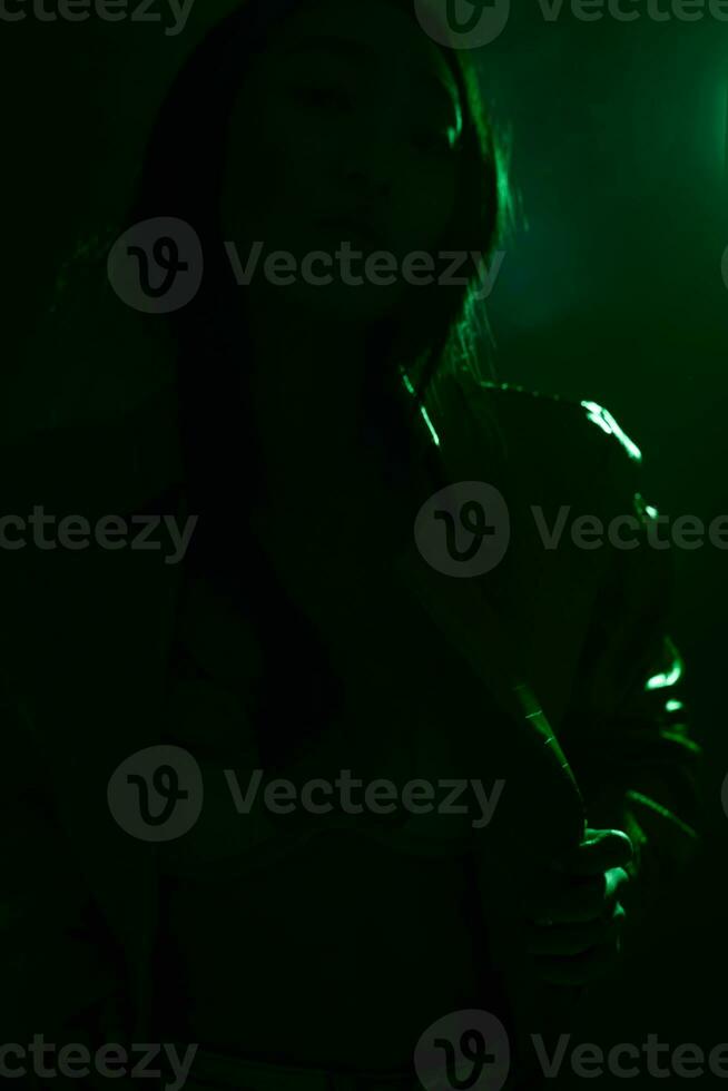 Neon woman concept fashionable colourful green light art trendy portrait smoke photo