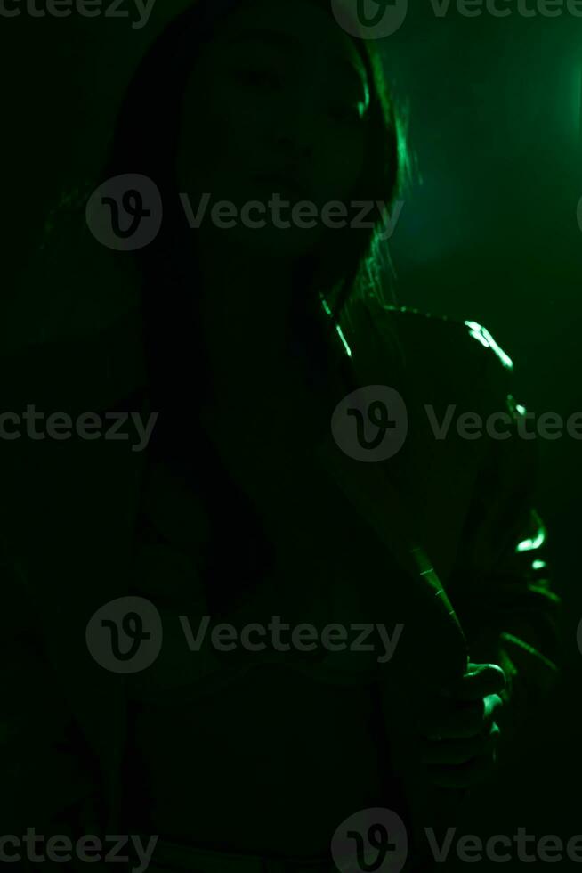 Neon woman concept fashionable colourful green light art trendy portrait smoke photo